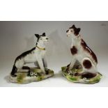 A pair of German porcelain models, of seated dogs,