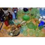 An early 20th century green glass press moulded glass cake stand, other plates; candlesticks,