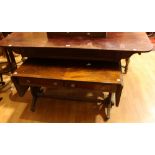 A Regency mahogany library table, rounded rectangular top above a frieze drawer, turned stretcher,