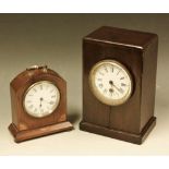 An Edwardian mahogany arched rectangular mantel timepiece, white enamel dial, Roman numerals,