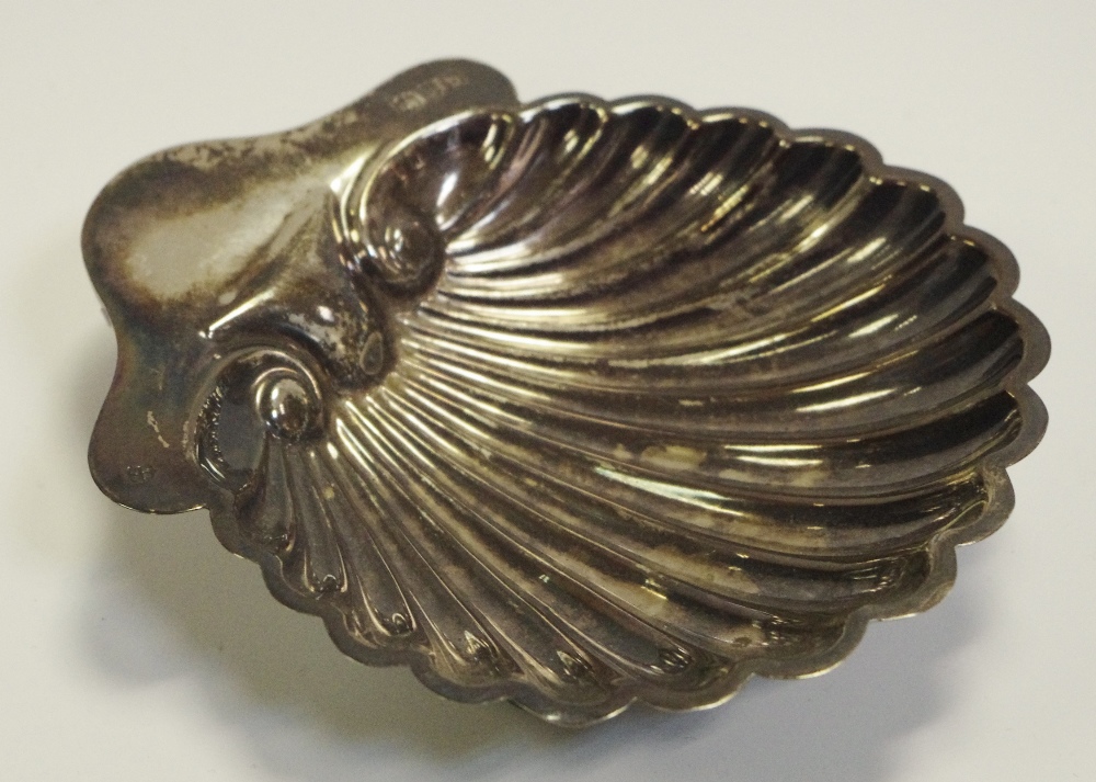 A Victorian silver shell shaped nut dish, ball feet,