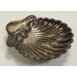 A Victorian silver shell shaped nut dish, ball feet,