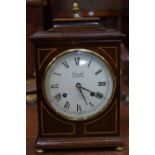 A contemporary Regency style bracket type mantel clock,