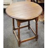 An early 20th century oak circular occasional table