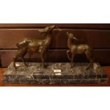 An Art Deco French bronzed sculptural group, Doe and Faun, naturalistically modelled,