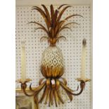 A pair of novelty cast iron and wrought metal pineapple two branch wall lights,