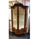 A Louis XVI style kingwood gilt metal mounted vitrine, serpentine bow front,