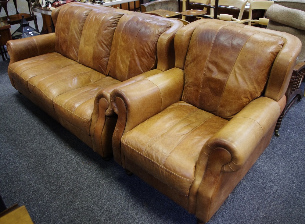 A contemporary brown leather 3-seat sofa and conforming armchair