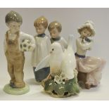 A Nao pottery figure, Boy with a Football; others, Choir Boys and Girl with Puppy,
