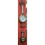 A late 19th/early 20th century oak cased aneroid barometer; another similar,