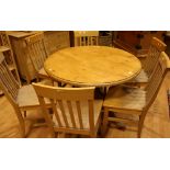 A pine kitchen table, circular top, triform base, 106.