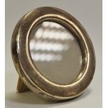 An Elizabeth II silver circular easel photograph frame,