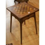 An Arts and Crafts game table,