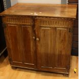 A Griffiths design oak side cabinet, in the 18th century taste,