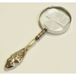 A silver hafted magnifying glass