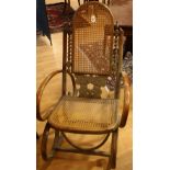 An early 20th century bentwood rocking chair,