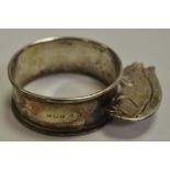 A George VI silver novelty napkin ring, applied with a squirrel,