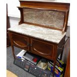 An Edwardian mahogany wash stand, marble back and top over two door cupboard, tapering square legs,