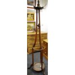 A late Victorian mahogany hall stand surmounted by turned finial above five brass hat hooks,