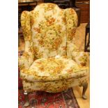 A George III design wingback reception armchair, scroll arms,