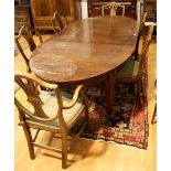 An early 20th century mahogany extending dining table, discorectangular top,