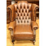 A Chesterfield type reception wingback office chair, deep button back, scroll arm,