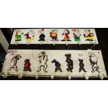 A reproduction cast metal wall mounted cup/coat rack, depicting comical dogs; another, similar,