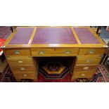 A contemporary campaign style twin pedestal writing desk,