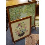 An early 20th century fire screen, woolwork girl frolicking in the woods, oak frame; another,