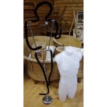 A shop display mannequin with flexible limbs; another,