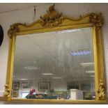 A large giltwood overmantel looking glass,