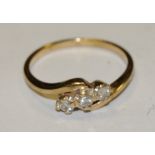 A 9ct gold diamond trilogy ring set on a twist size R 2.5g gross.