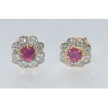 A pair of ruby and diamond floral cluster earrings,