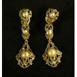 A pair of Art Deco style diamond and half pearl drop earrings, open ornate three section body,