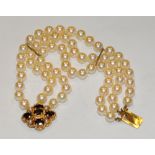 A three strand cultured pearl bracelet, uniform creamy white pearls approx 7mm diameter,