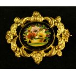 A Victorian pietra durra floral basket of flowers brooch, ornate yellow metal frame, 45mm wide,