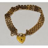 A 9ct gold textured gate bracelet, heart padlock clasp, 21.