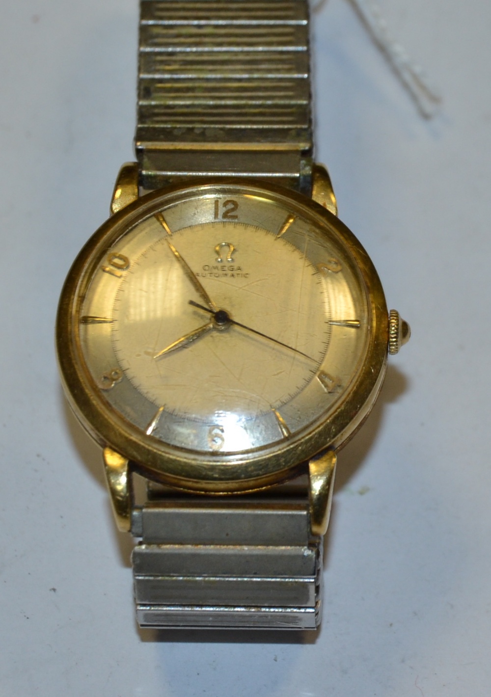 Omega - a vintage 1940s automatic bumper wristwatch, two tone white and silver dial,