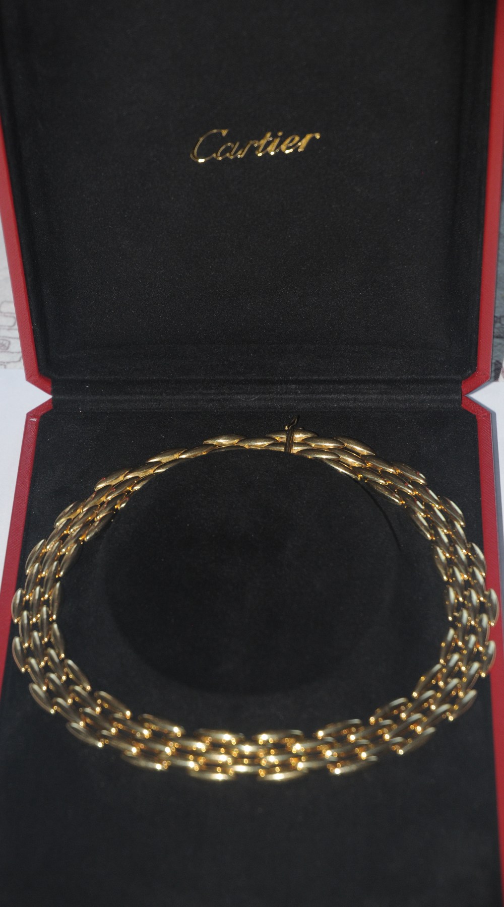Cartier - an 18ct gold Gentiane collection torpedo chain link five row articulated choker necklace,