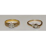 An 18ct gold diamond trilogy ring, the central claw set round diamond approx. 0.