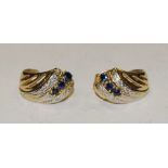 A pair of diamond and sapphire accented curled leaf earrings,
