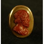 A late 19th century cameo signet ring, red carved cameo profile possibly Homer,
