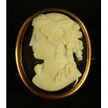 A 19th century agate cameo oval panel brooch, Neoclassical maiden with flowing woven hair up,