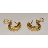 A pair of 18ct gold ridged spiral hoop earrings, clip lock action, stamped 750, import marks,