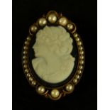 A Victorian style cameo pendant brooch, maiden facing right,