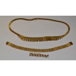 Jewellery - a 9ct gold textured retro fan necklace, a similar brick link bracelet; a spiral brooch,