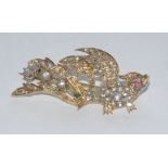 A 19th century diamond ruby and emerald exotic bird brooch, pink ruby eye, emerald accented tail,