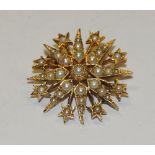 An Edwardian style 9ct gold seed pearl star burst brooch,