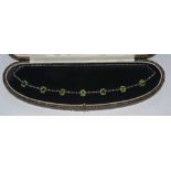 An Edwardian Peridot and seed pearl necklace,