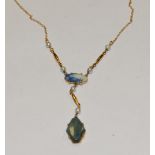 A Victorian 9ct gold pendant necklace set with seed pearls and semi precious polished stones 3.